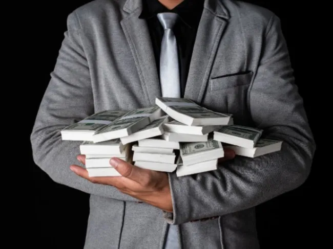 man holding cash